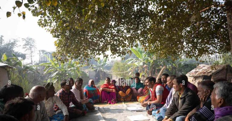 people gathering under a tree for loadsheding. representional photo